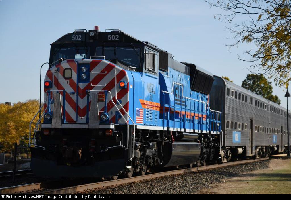 inbound commuter shoves out of the station